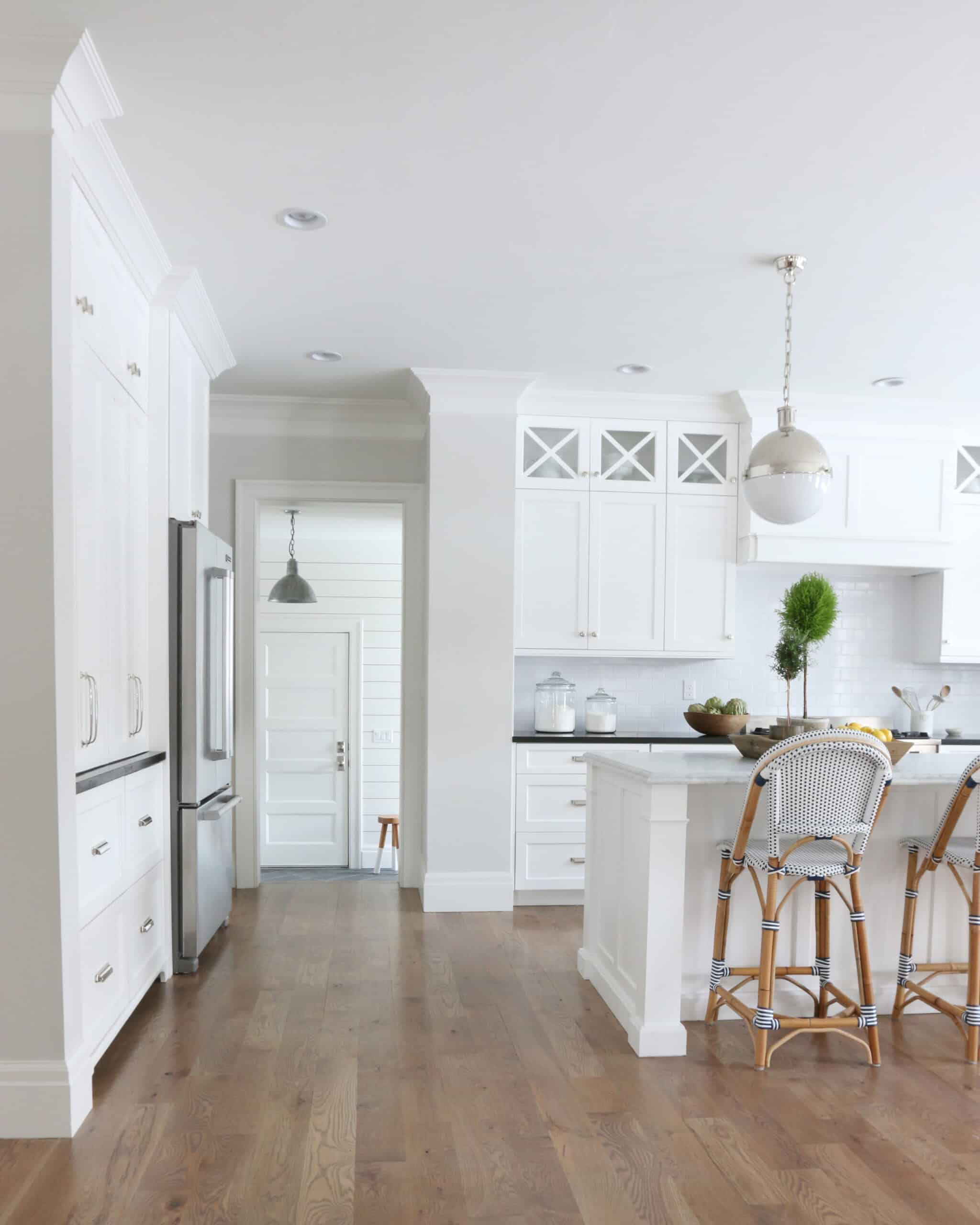 kitchen with Classic Gray walls and white cabinets