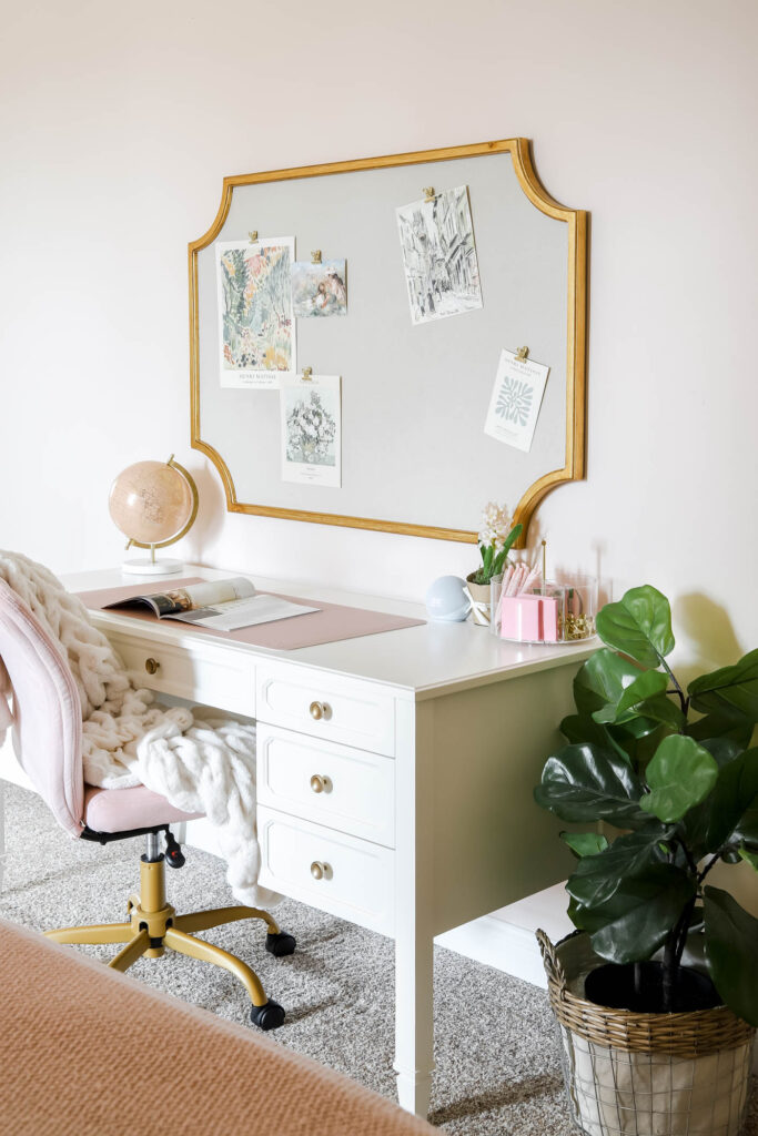 teen girl desk study area with large pin board.