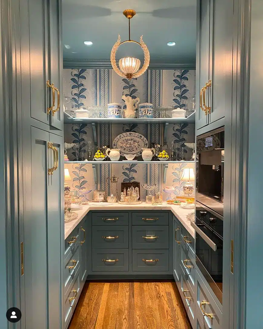 This butler's pantry feels most like a true serving pantry, emphasizing displays of beautiful serving pieces amid complementary patterns and colors.