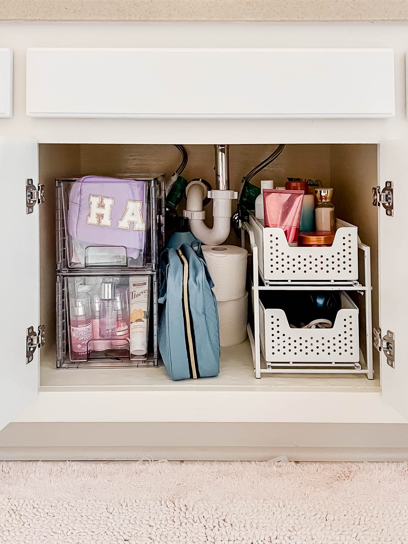 Organized under-the-stink cabinet with drawers.