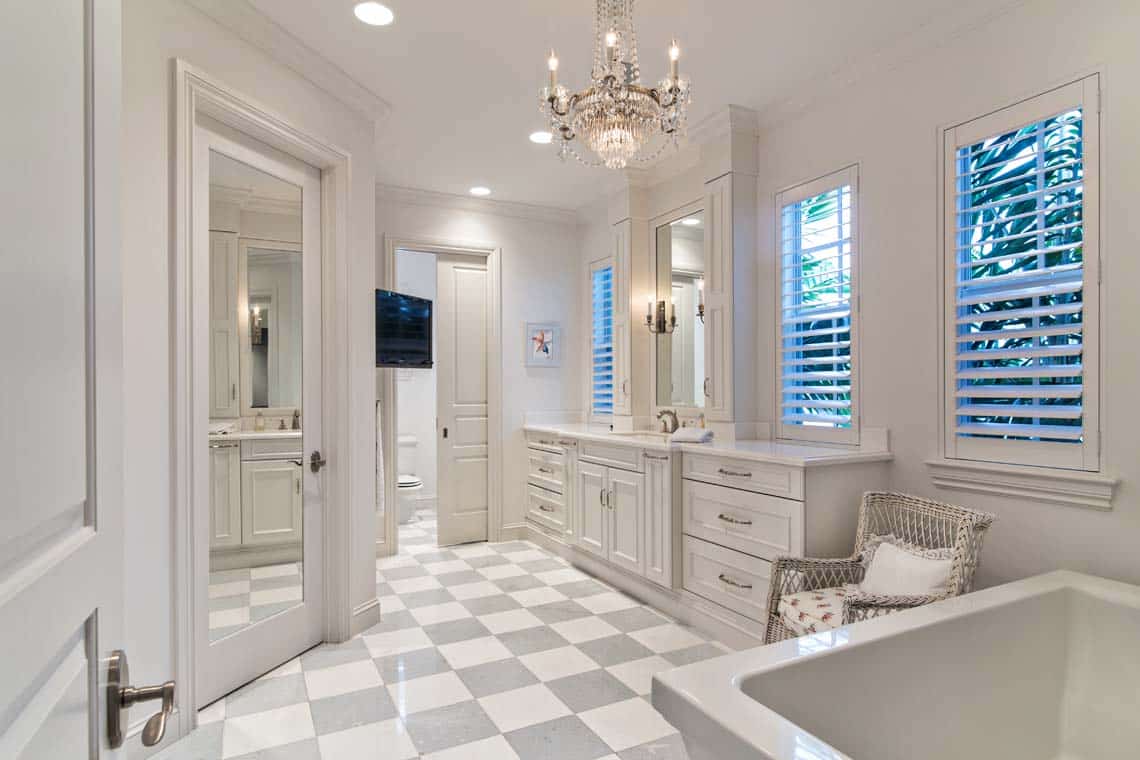 bathroom with light gray and white checkered tile floors.