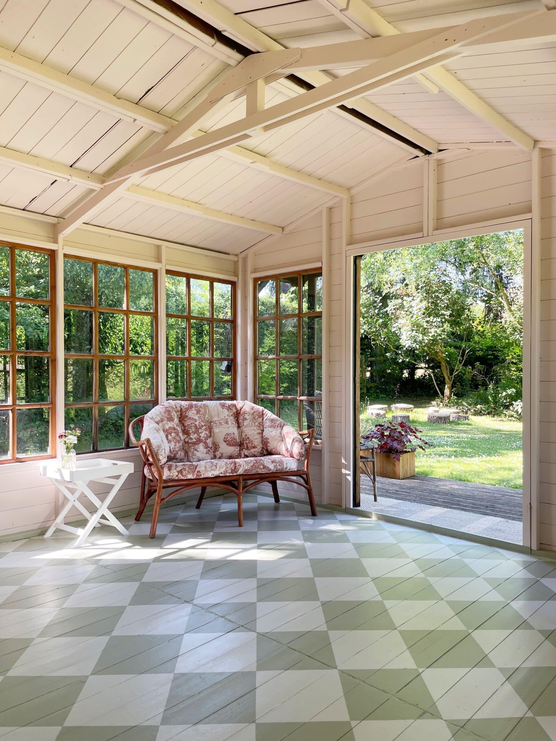 sunroom with painted checkered pattern on the wood floors