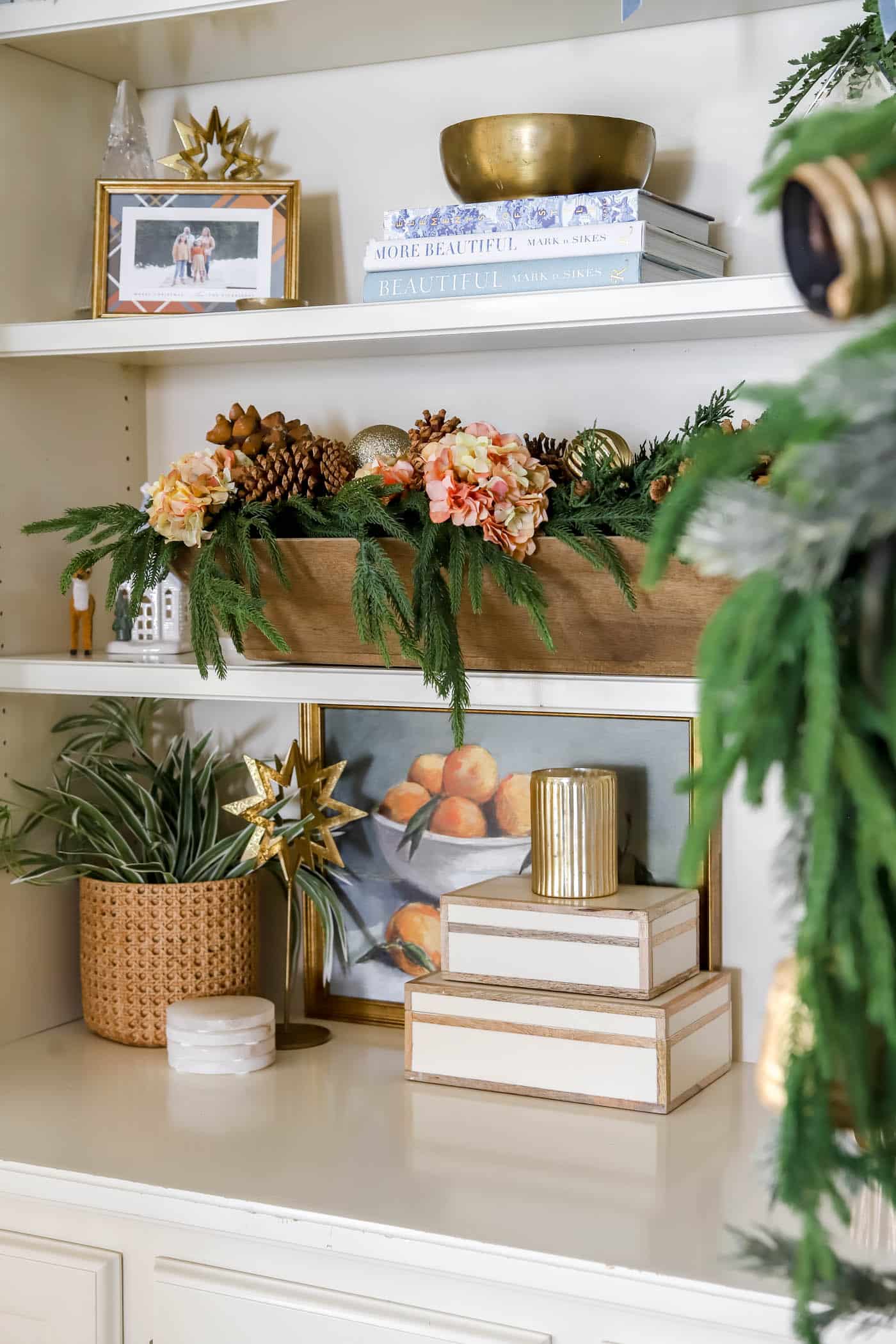 orange citrus art on christmas shelves.