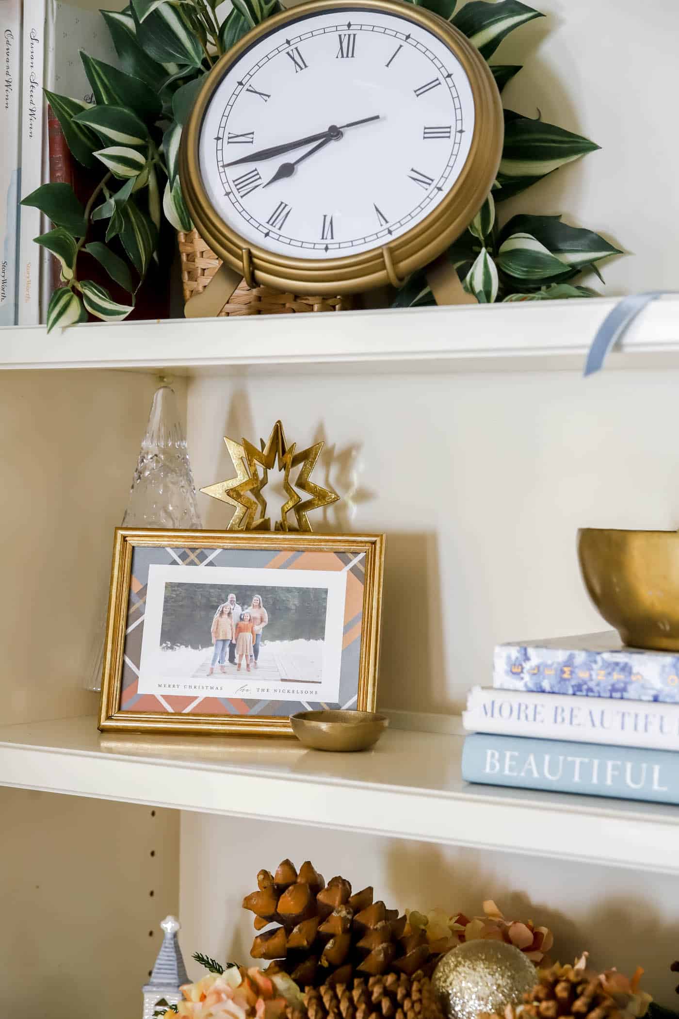 orange and blue plaid christmas card in a frame.