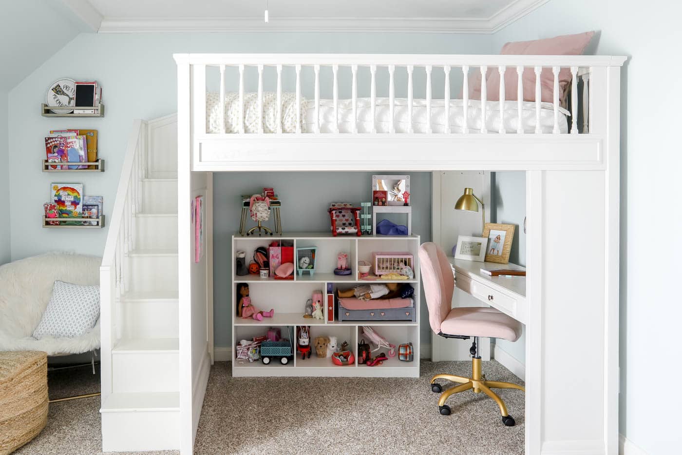 loft bed with toy storage and a desk underneath.