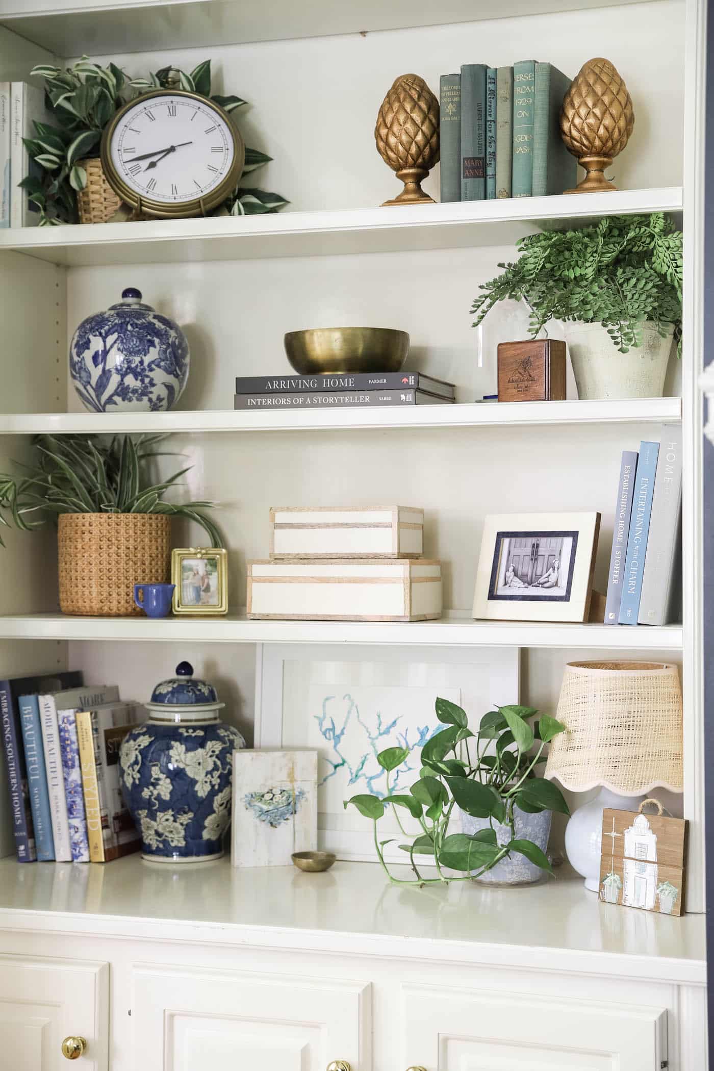 pretty summer built-in bookshelves with blue and white decor.