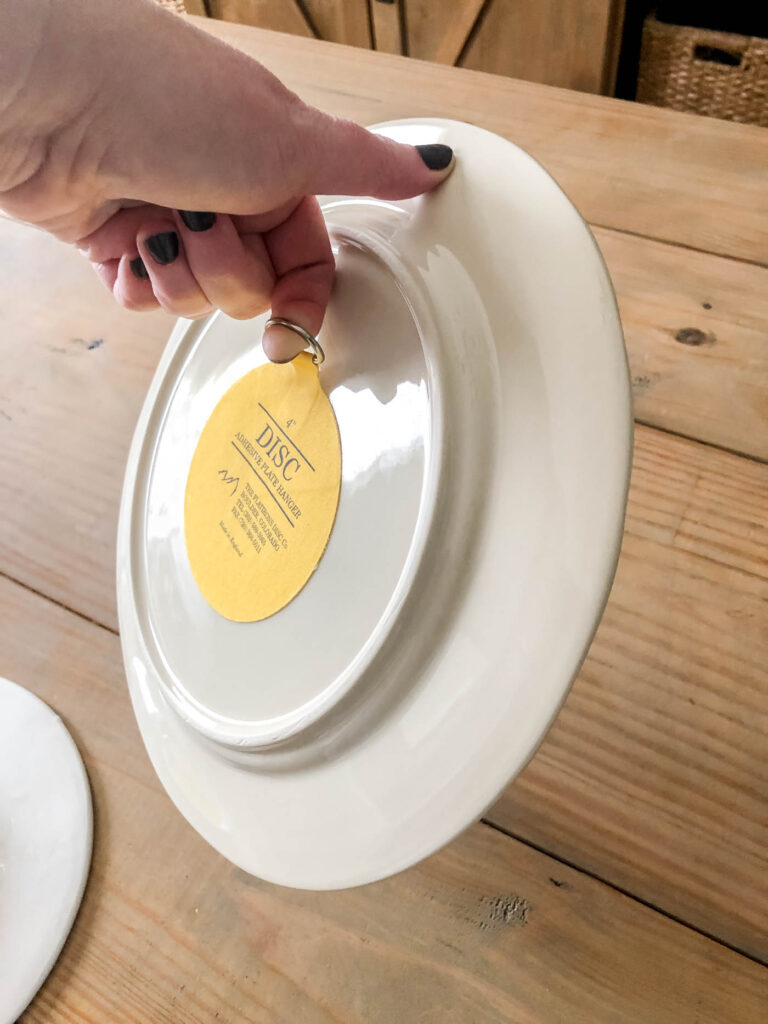 leave the plate hanger for 24 hours and then test before hanging on the wall.