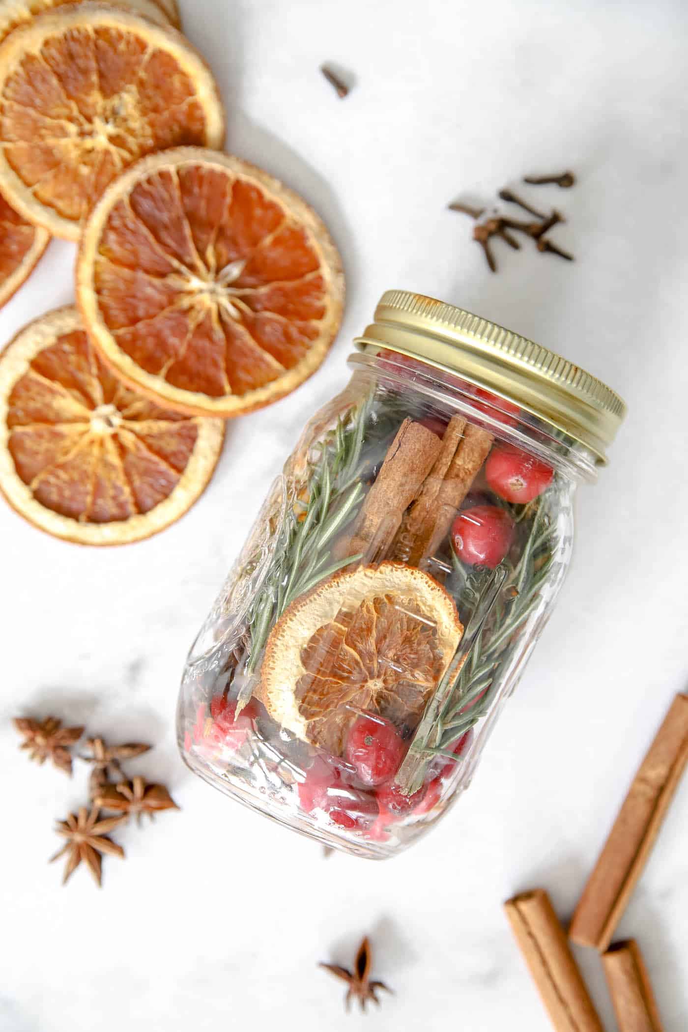 christmas simmer pot ingredients in a mason jar.