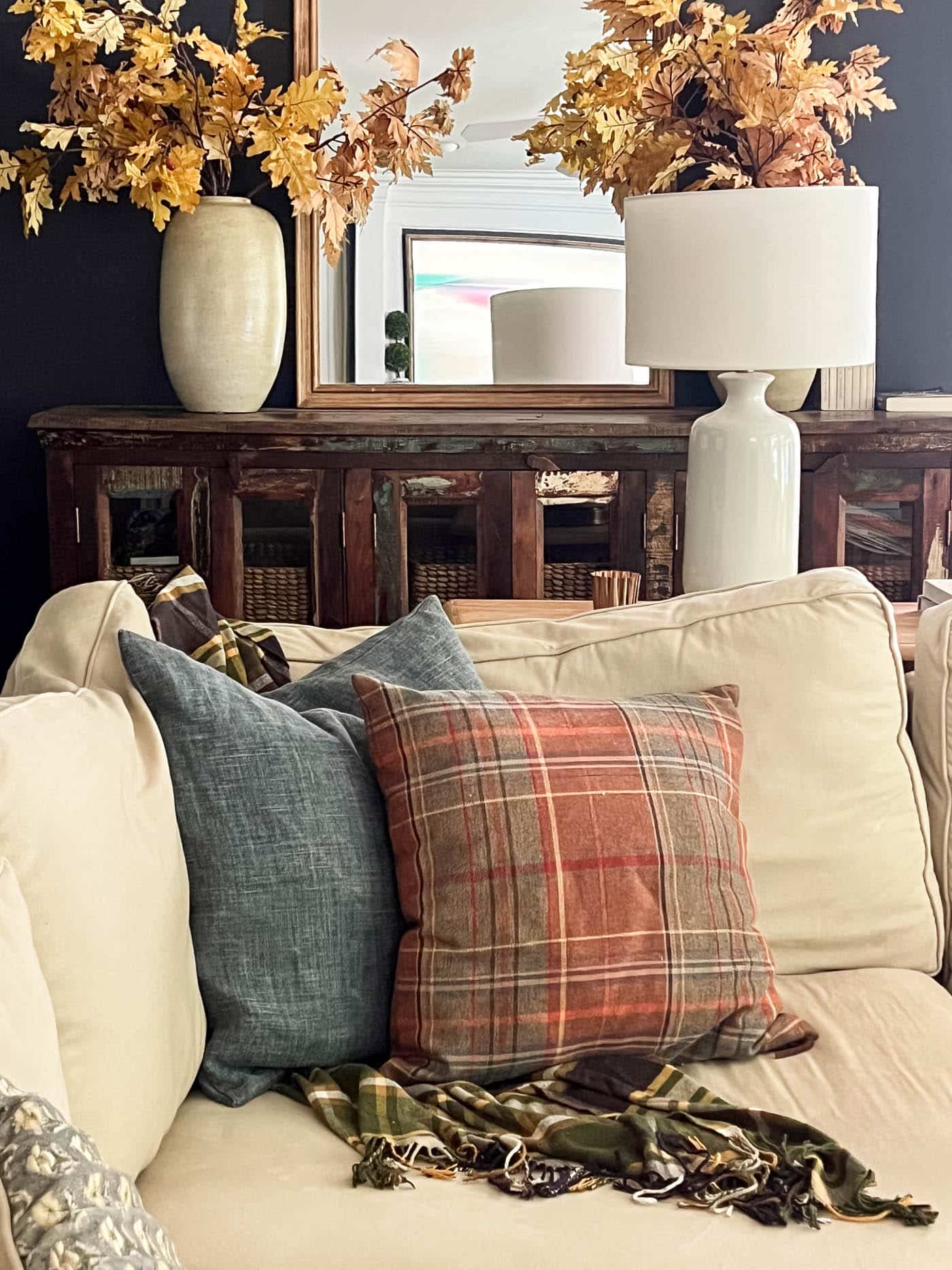 fall pillows in the corner of the living room