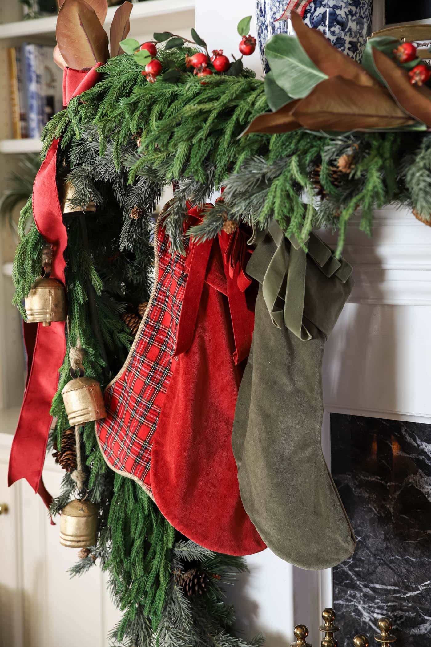 Christmas stockings with a full mantel garland.