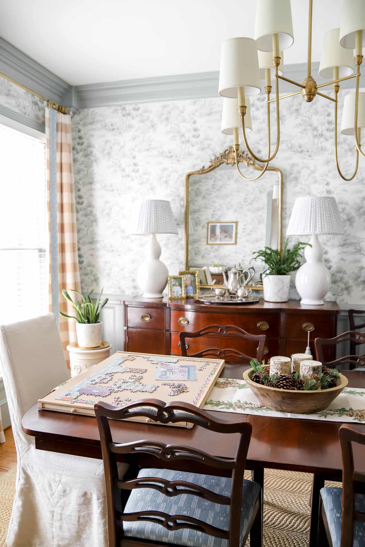 puzzle table in the dining room after Christmas winter decor.