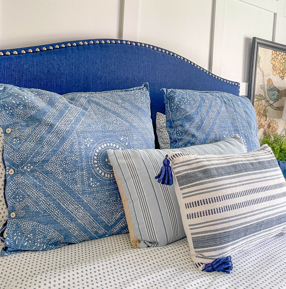 cottage core bedroom makeover with blue pillows