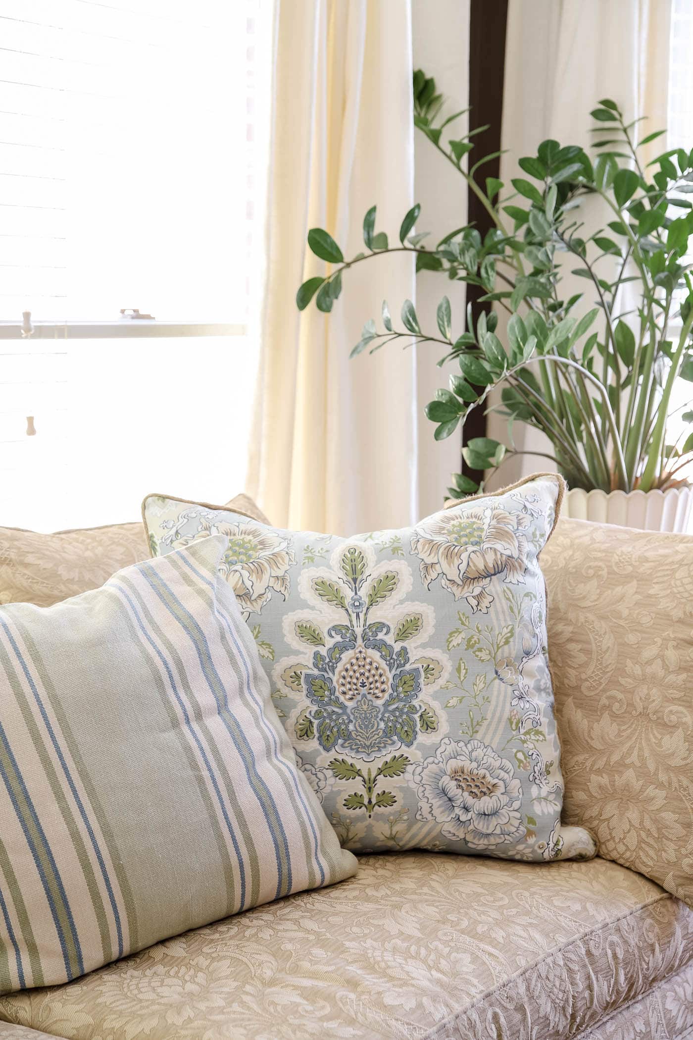 stripe and floral throw pillows for spring bedroom decor.