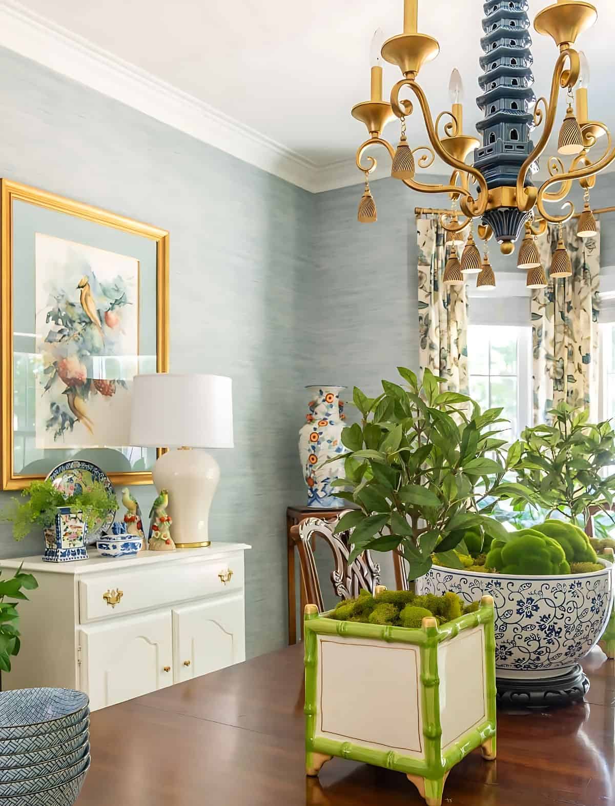 white buffet in the dining room with blue walls and traditional decor.