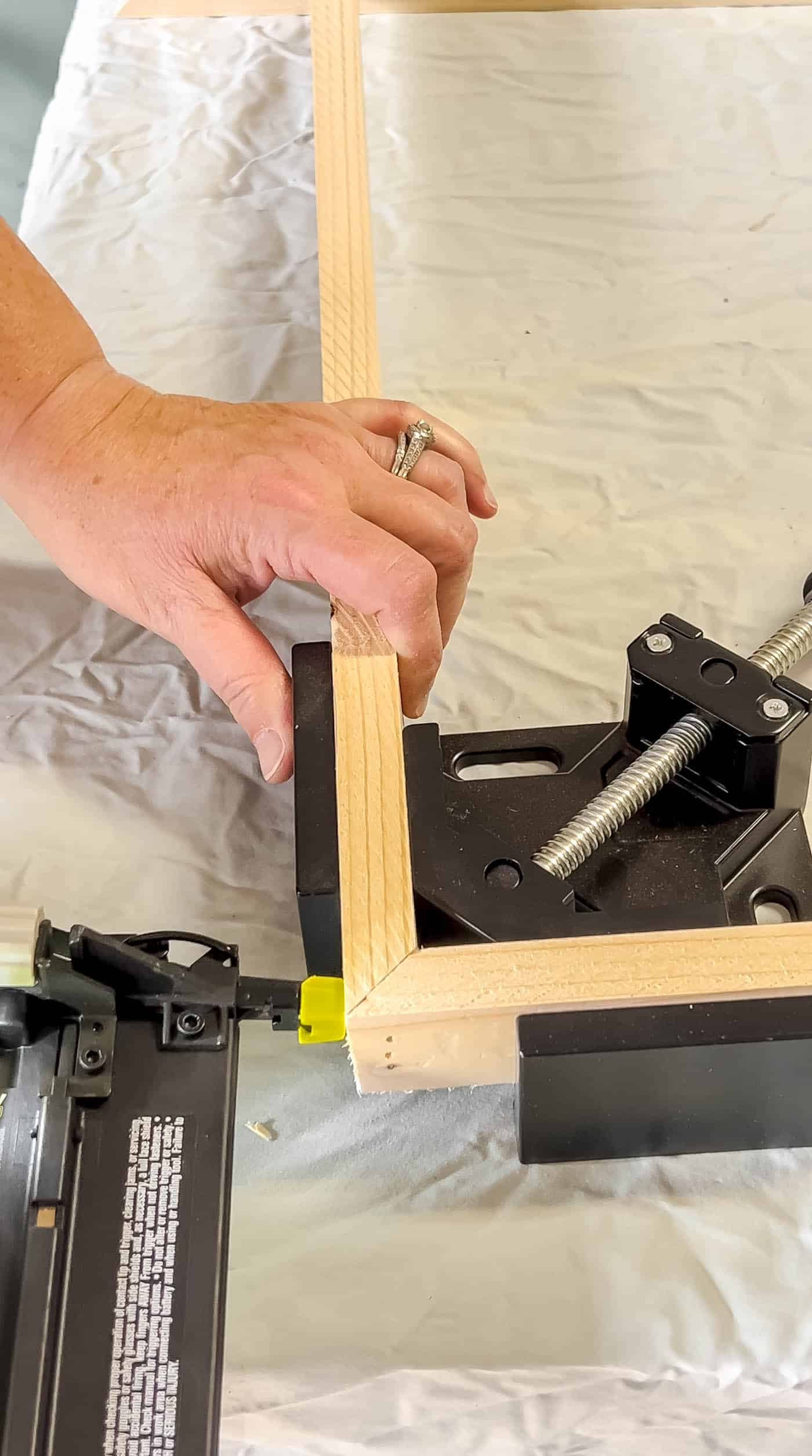 brad nail the corner of a frame in a corner clamp.