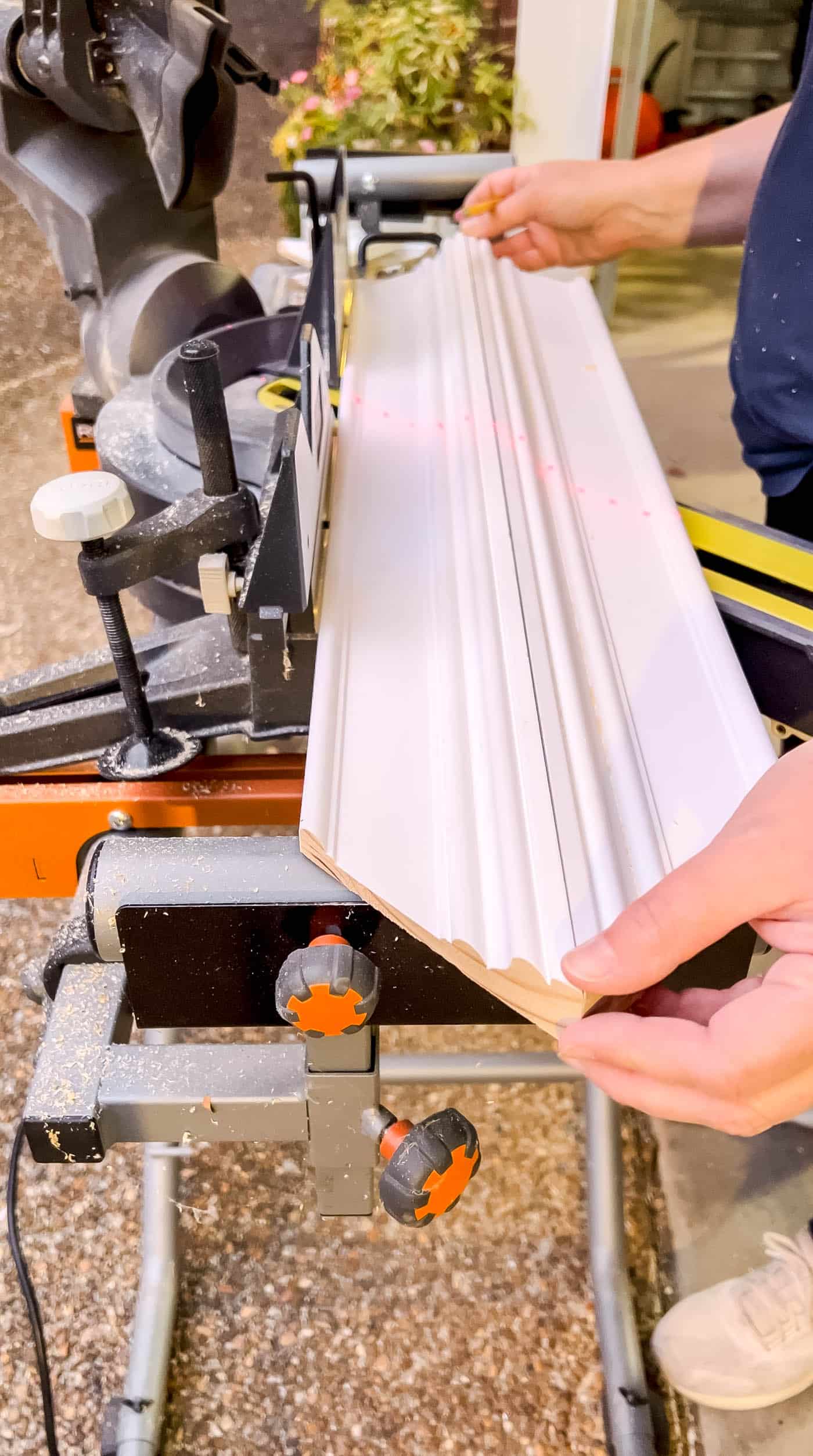 Cutting the trim pieces for a custom Frame TV frame.