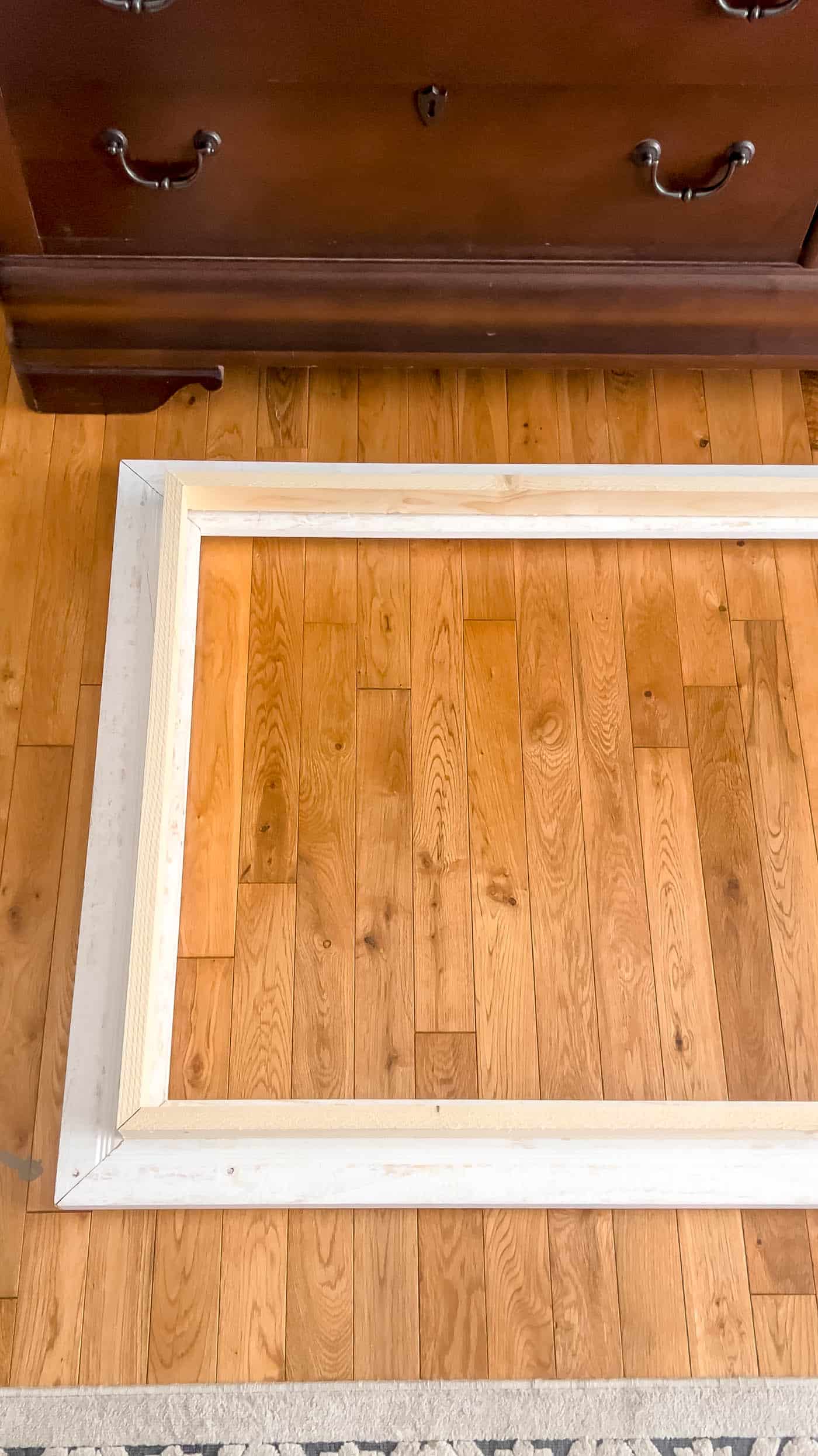 building a frame on the wood floor.