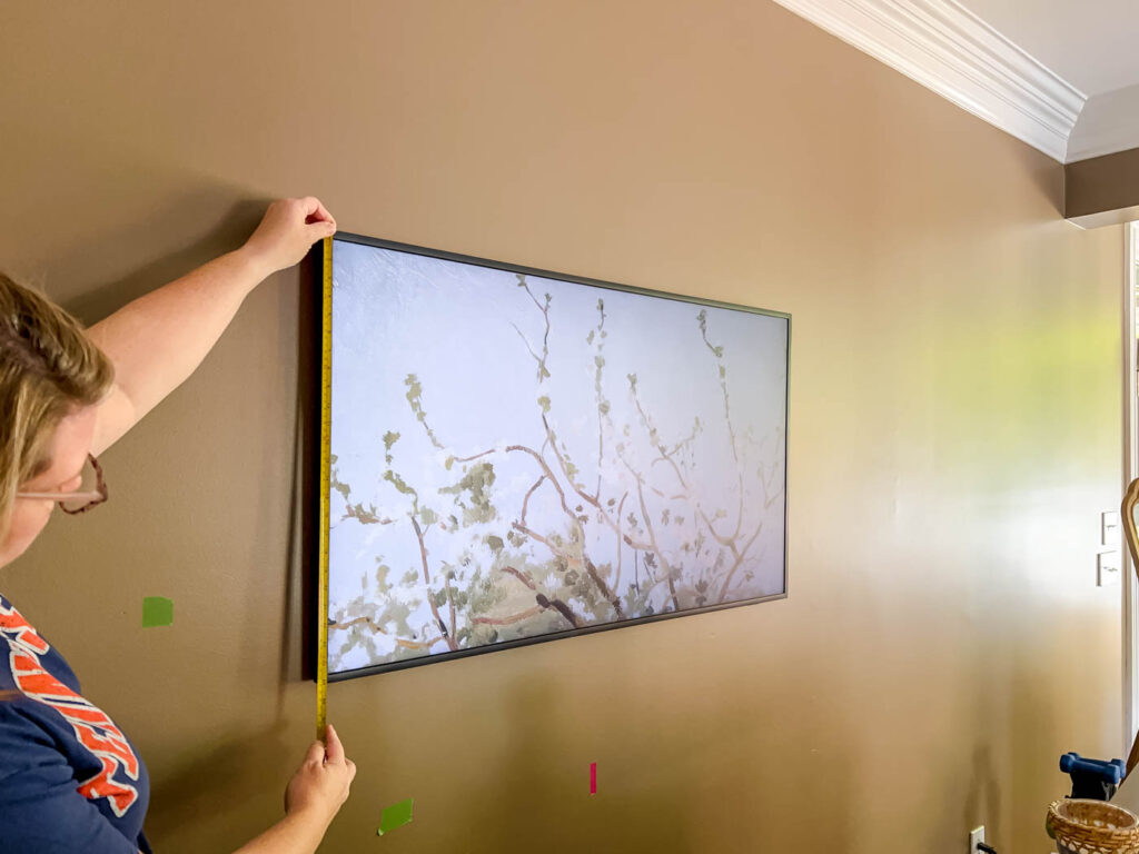 measuring the Frame TV to make a frame.