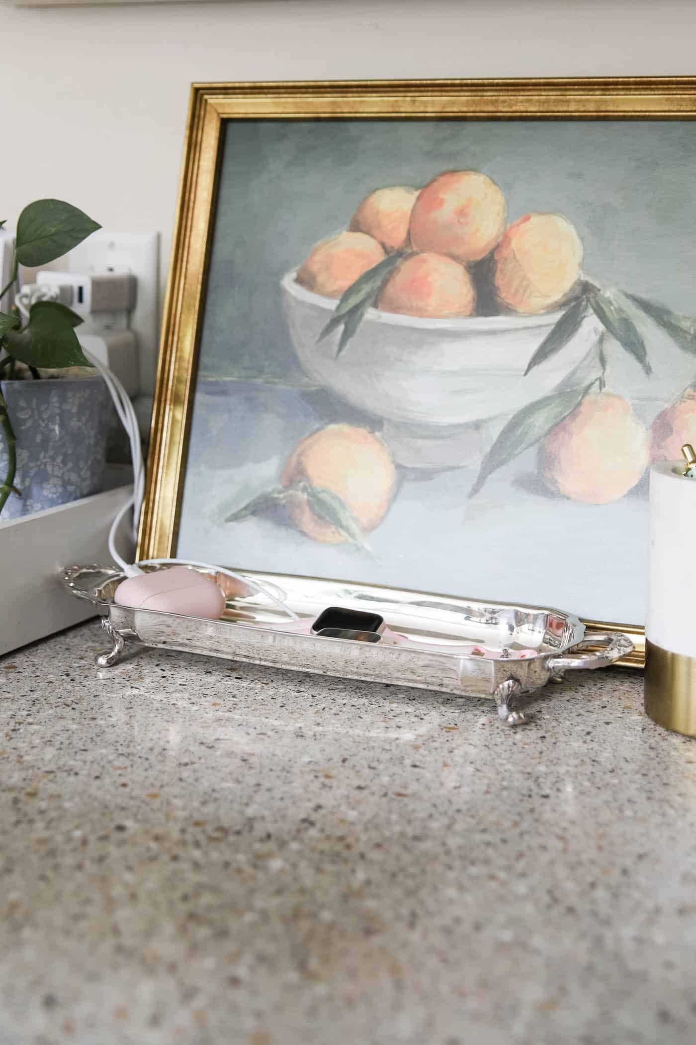 silver card tray used as an Apple Watch charging tray. 