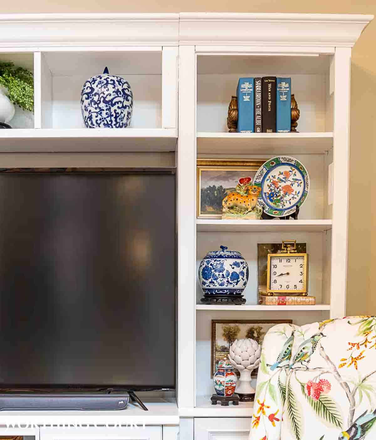 Learn how to decorate an entertainment center with simple styling ideas