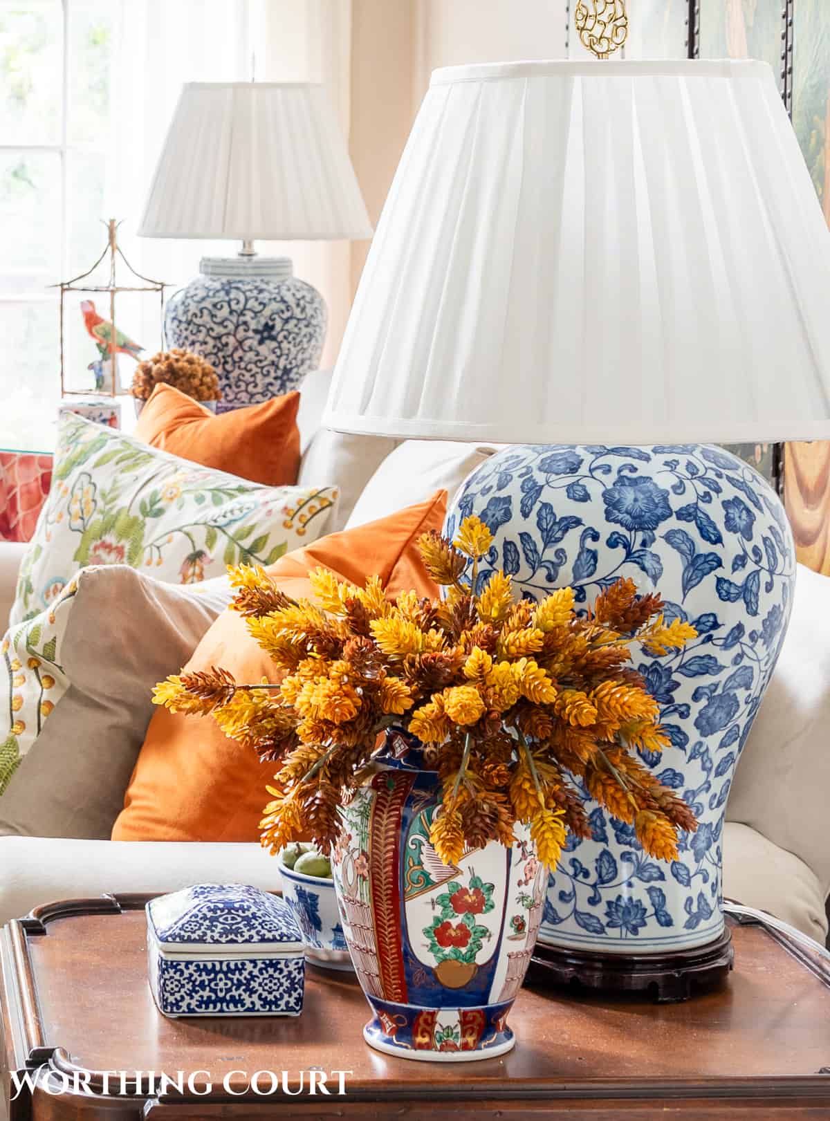 fall floral arrangement on an end table.