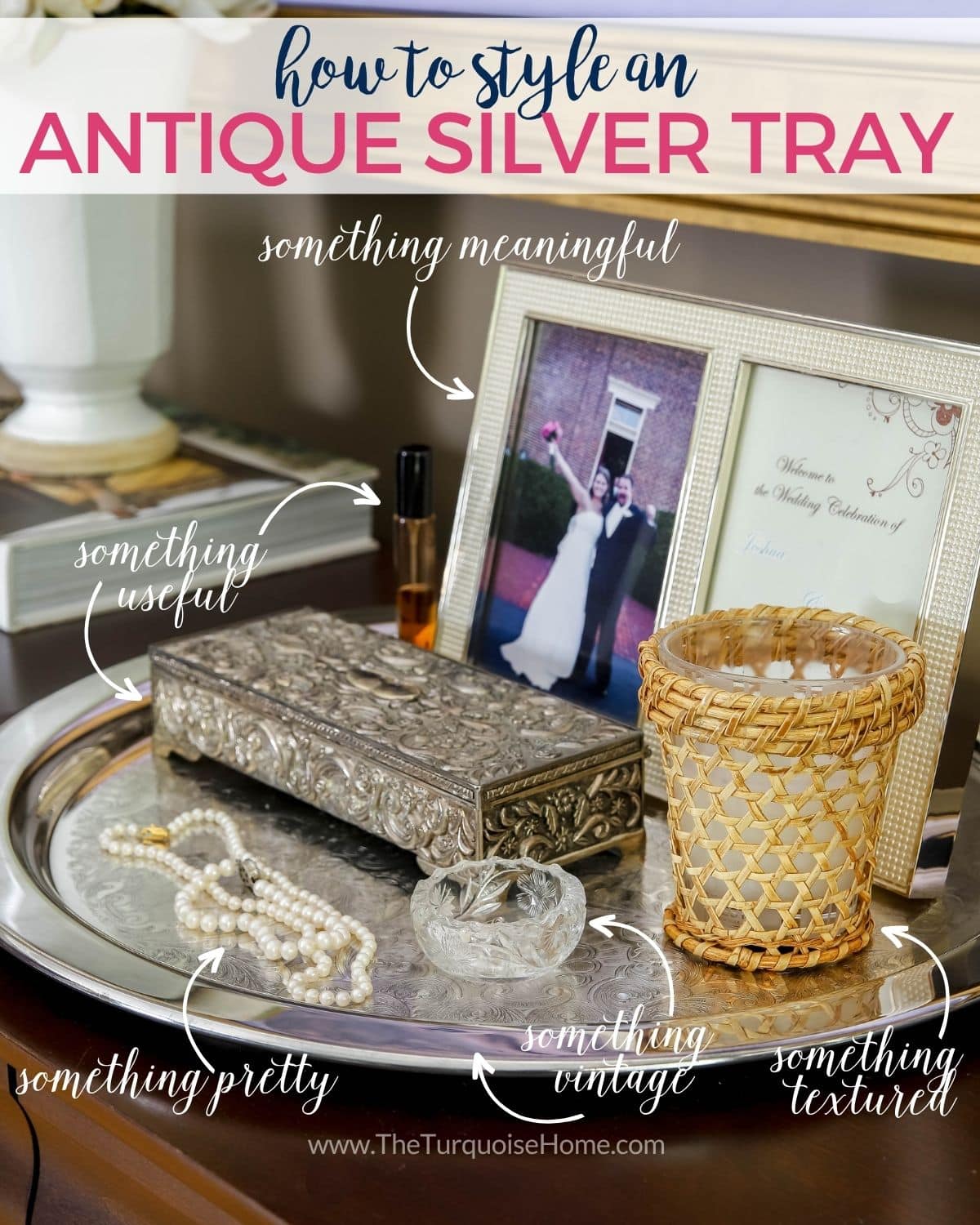 How to style an antique silver tray: silver tray on a bedroom dresser holding a framed photo, jewelry box and pearl necklaces.
